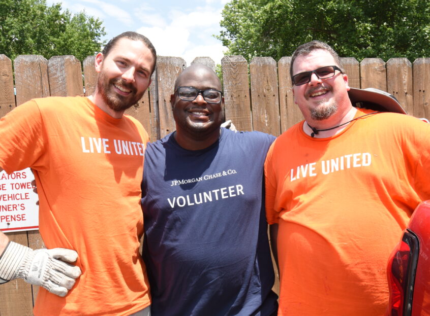 three men volunteering
